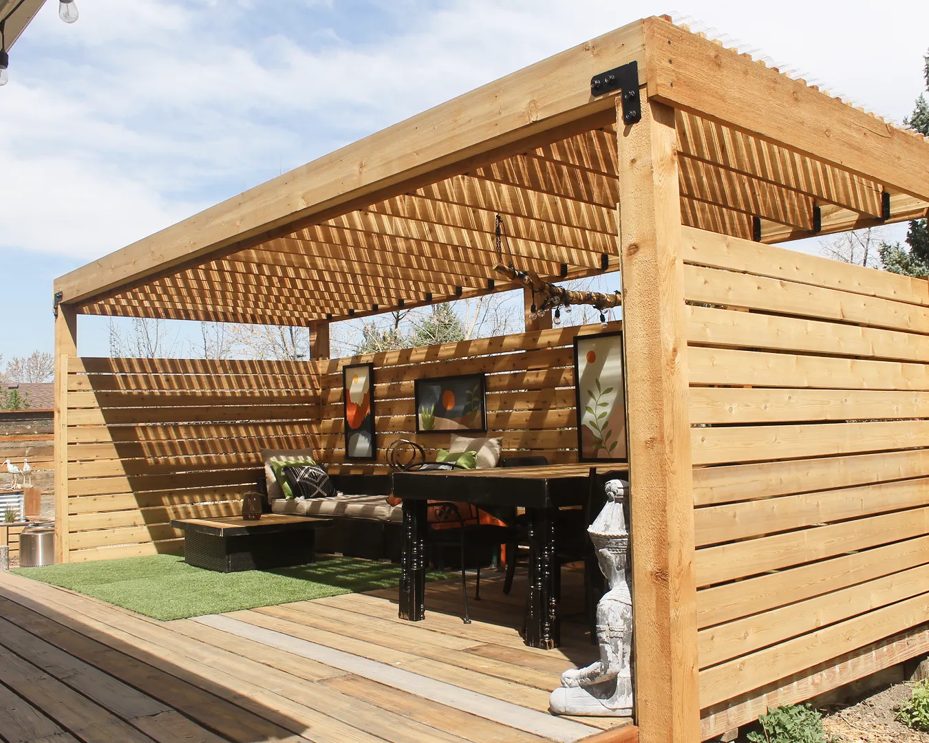 Complete outdoor living space with custom deck and pergola in Colorado by Decks by Caio